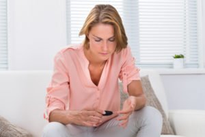 woman checking blood sugar