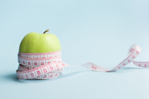 Image of apple with weight loss tape measure