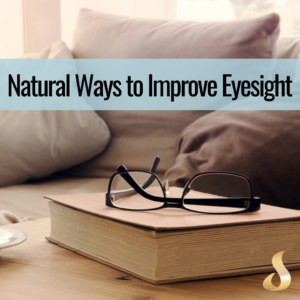 image of book with reading glasses on top 