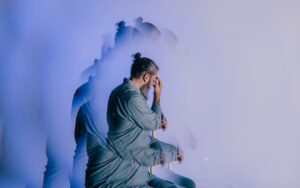 Man wrestling with intrusive thoughts