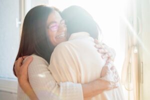 Parent hugging child indicating recovery and connection