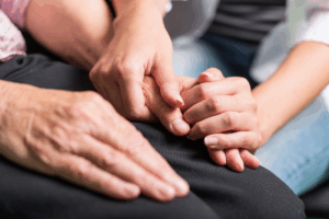 People holding hands for encouragment for addiction recovery