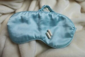 sleep mask and melatonin capsules