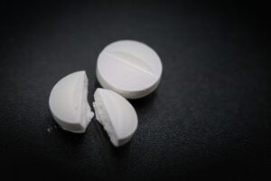 2 pills laying on a black cloth for the placebo effect